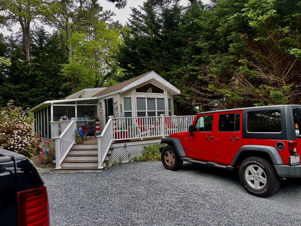 185 Cotuit Road, Unit C5 ASPEN Sandwich, MA 02563 - Photo 6 of 17 a front view of a house with parking space