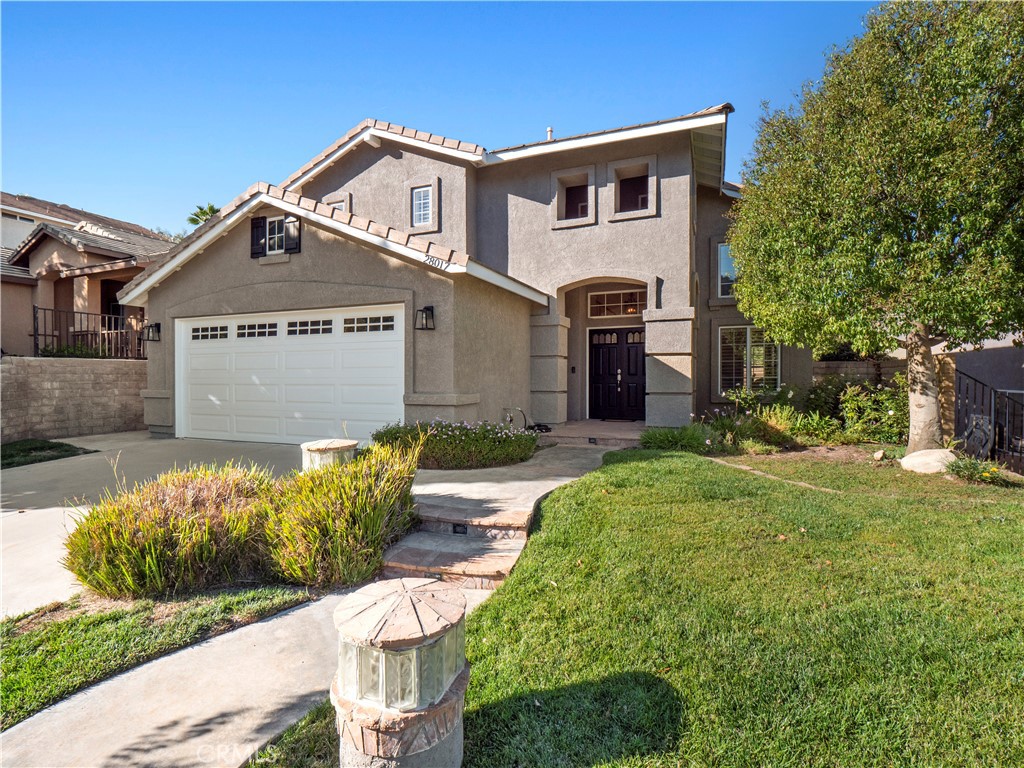 28017 Cascade Road Castaic, CA 91384 - Photo 1 of 1 a front view of a house with garden