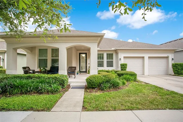front view of a house with a yard