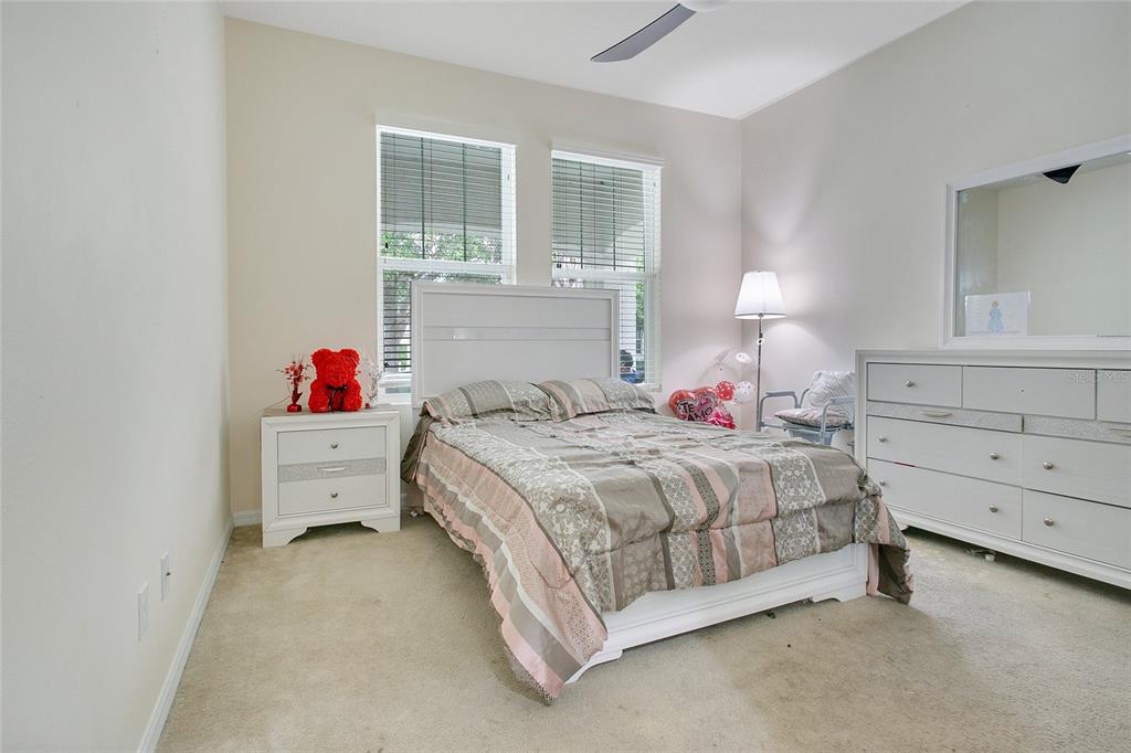 4918 Wildwood Pointe Road Winter Garden, FL 34787 - Photo 14 of 33 a bedroom with a bed and window