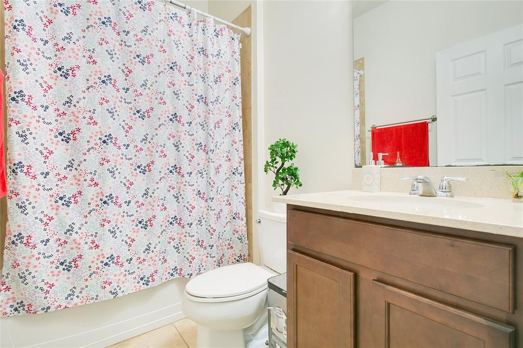 4918 Wildwood Pointe Road Winter Garden, FL 34787 - Photo 15 of 33 a bathroom with a sink and a toilet