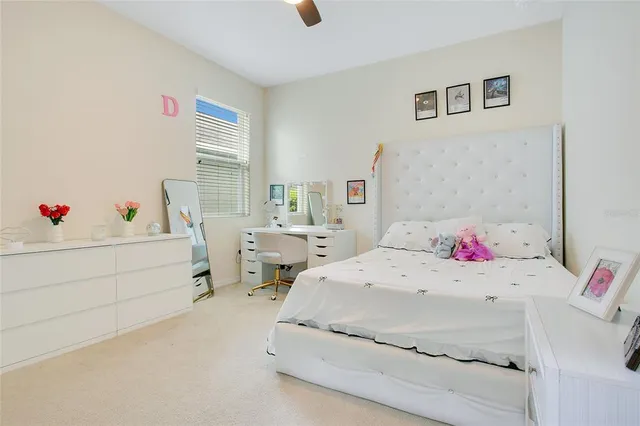 a bedroom with a bed and a table