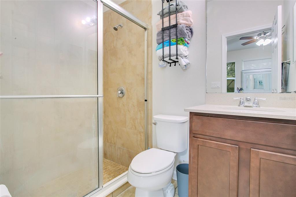 4918 Wildwood Pointe Road Winter Garden, FL 34787 - Photo 18 of 33 a bathroom with a sink toilet and shower