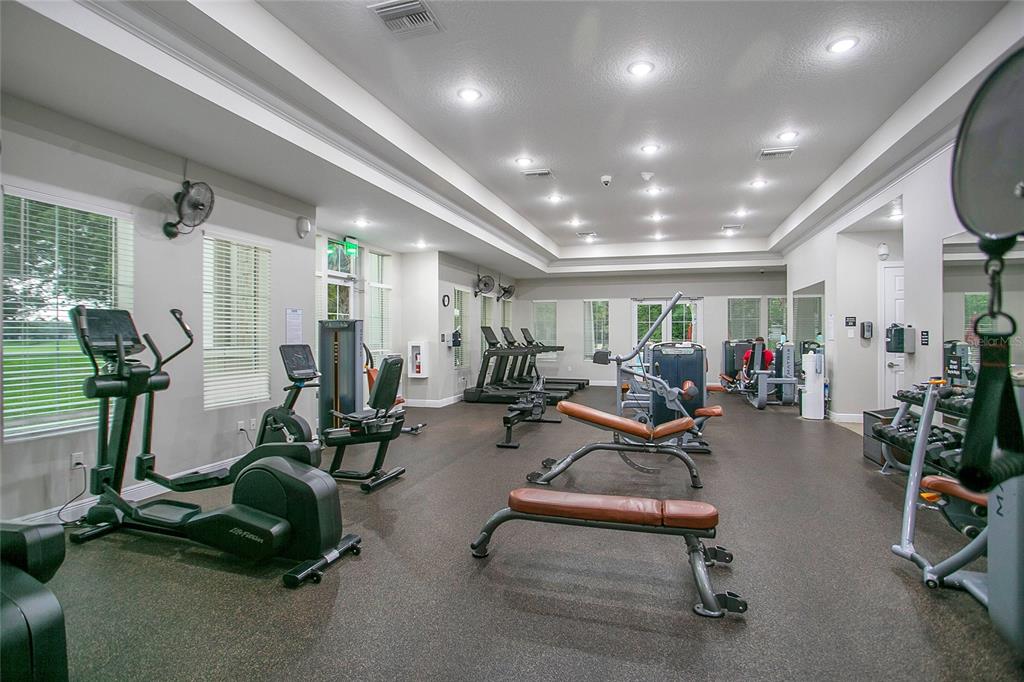 4918 Wildwood Pointe Road Winter Garden, FL 34787 - Photo 25 of 33 a view of a room with gym equipment