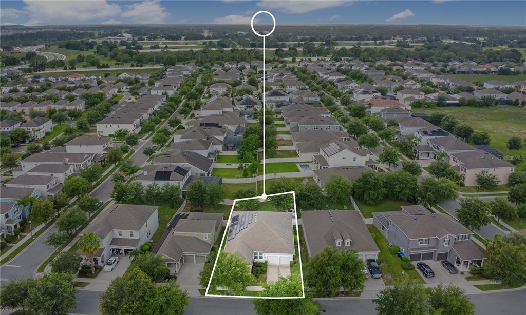 4918 Wildwood Pointe Road Winter Garden, FL 34787 - Photo 30 of 33 an aerial view of a house with a yard and lake view