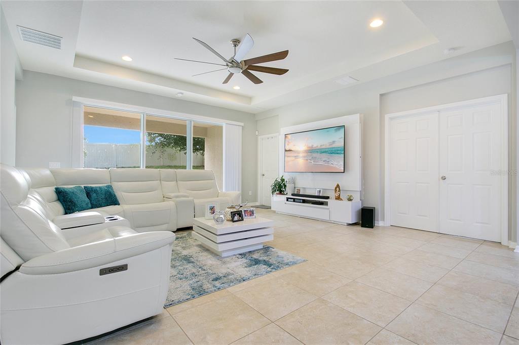 4918 Wildwood Pointe Road Winter Garden, FL 34787 - Photo 4 of 33 a living room with furniture and white walls