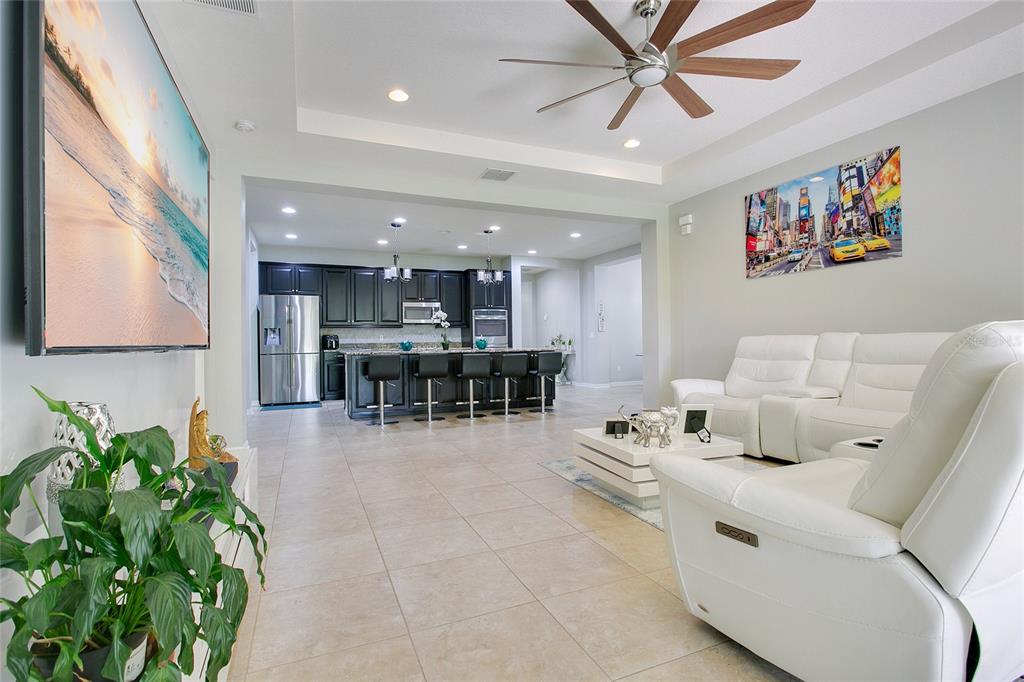 4918 Wildwood Pointe Road Winter Garden, FL 34787 - Photo 5 of 33 a living room with furniture and kitchen view