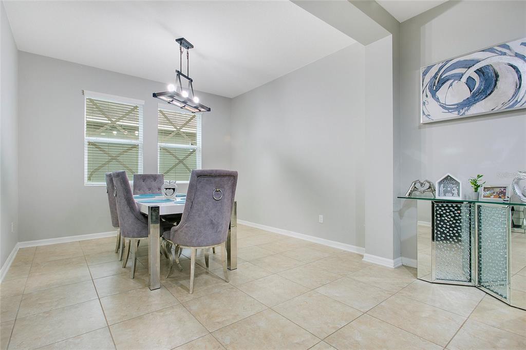 4918 Wildwood Pointe Road Winter Garden, FL 34787 - Photo 6 of 33 a dining room with furniture and window