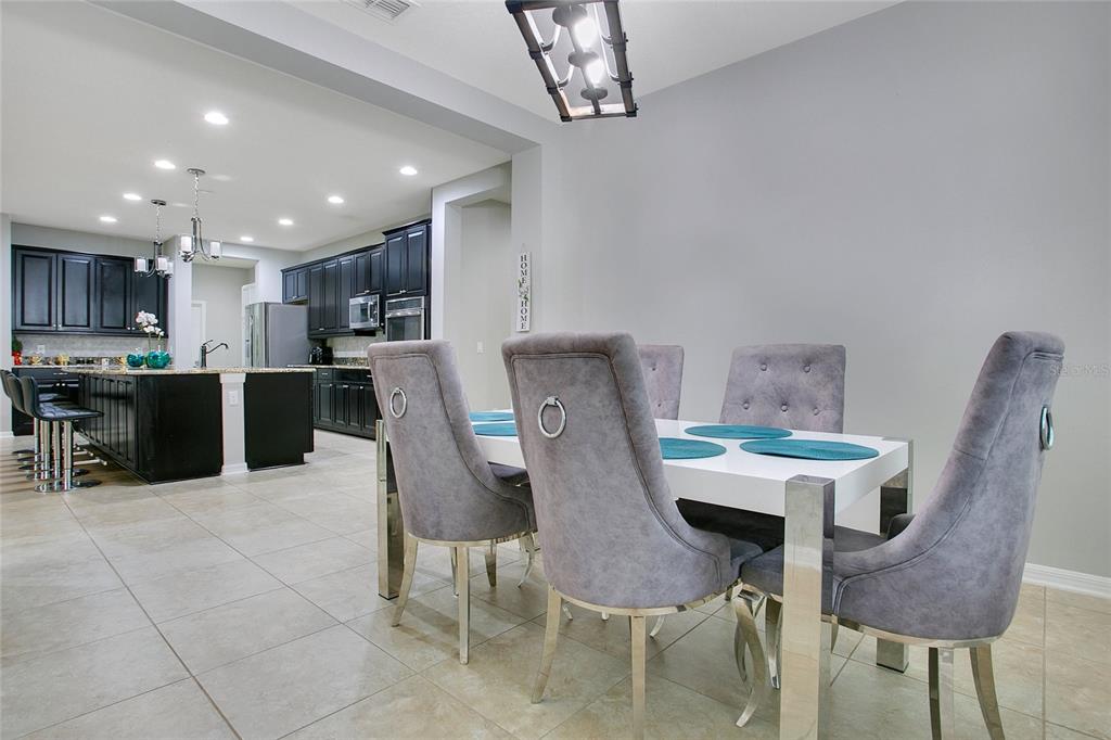 4918 Wildwood Pointe Road Winter Garden, FL 34787 - Photo 7 of 33 a view of kitchen with furniture and wooden floor