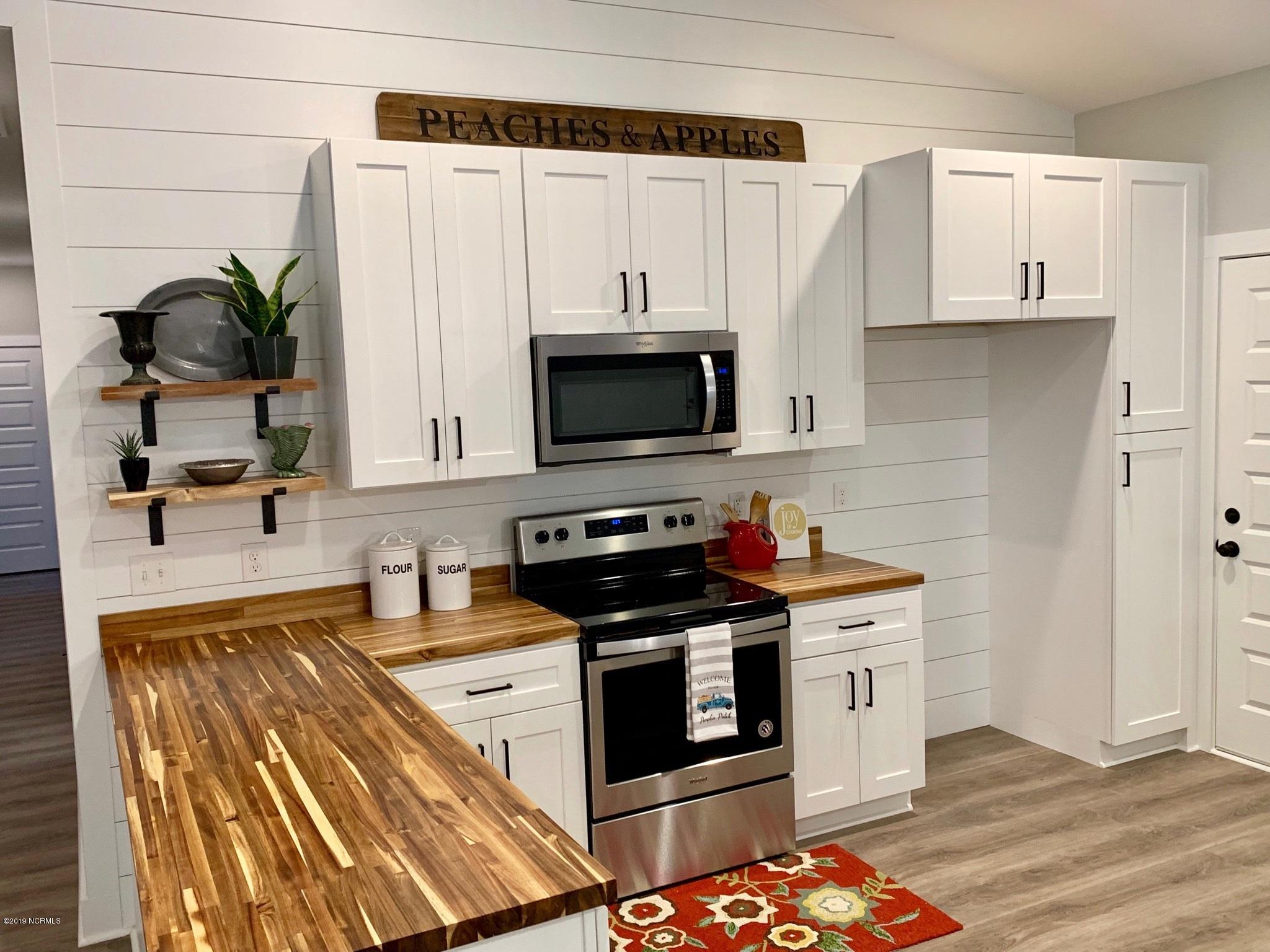 604 Washington Acres Road Hampstead, NC 28443 - Photo 6 of 17 This Home is now 85% complete. Completed staged photos are from an identical home built at 157 Fairfield Drive, Wilmington, NC 28401 which just closed for $299,900.