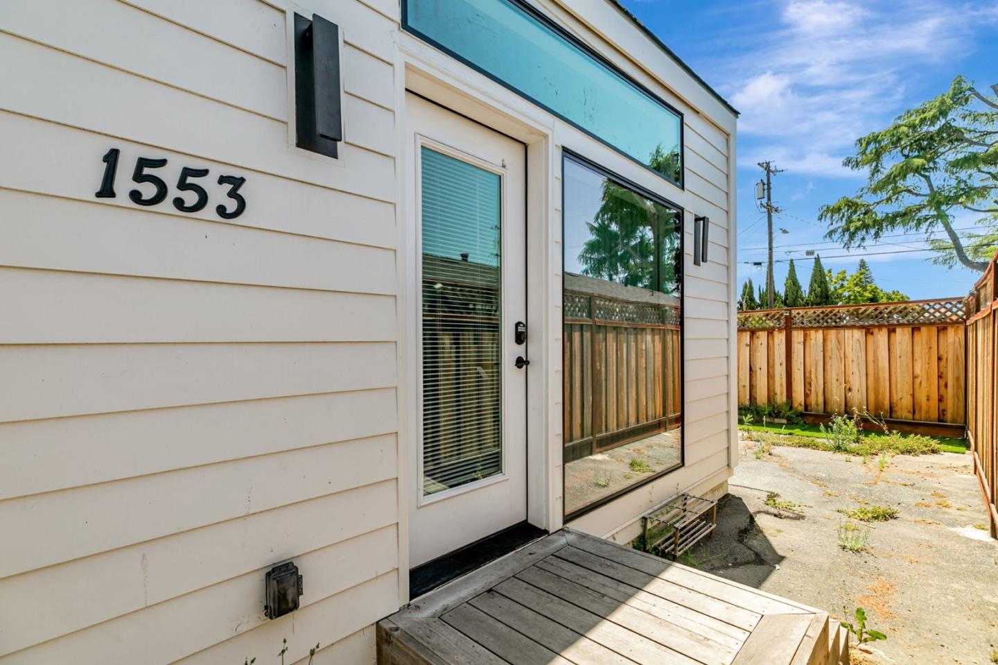 1555 Washington Street Santa Clara, CA 95050 - Photo 7 of 19 a view of a wooden door and a window