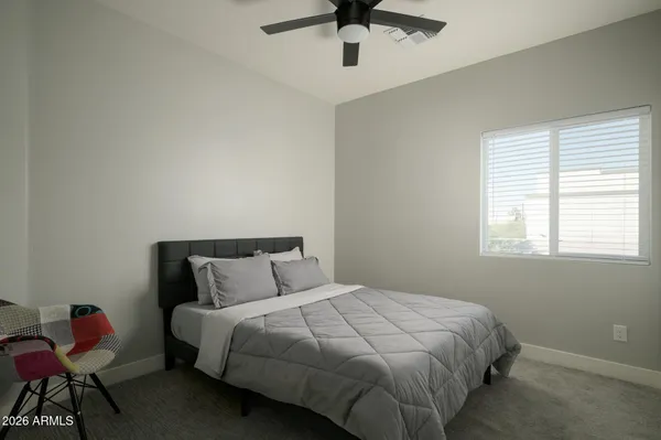 a bedroom with a bed and window