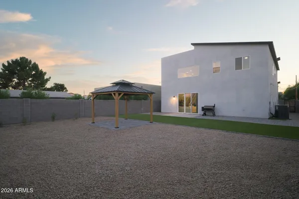 a house view with a backyard space