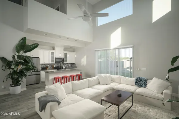 a living room with furniture or couch and a large window