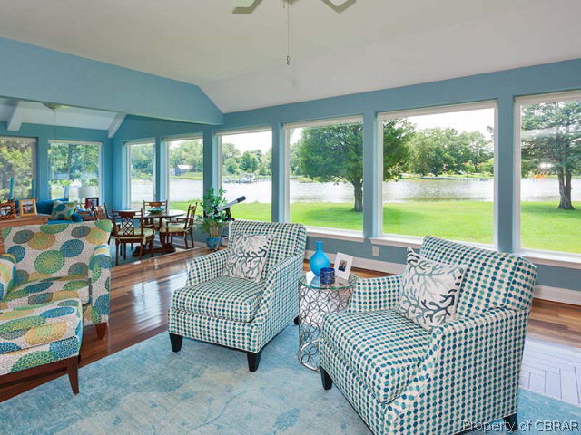 155 Lillys Neck Road Moon, VA 23119 - Photo 8 of 38 Living room flowing into the sun porch with fantastic waterviews