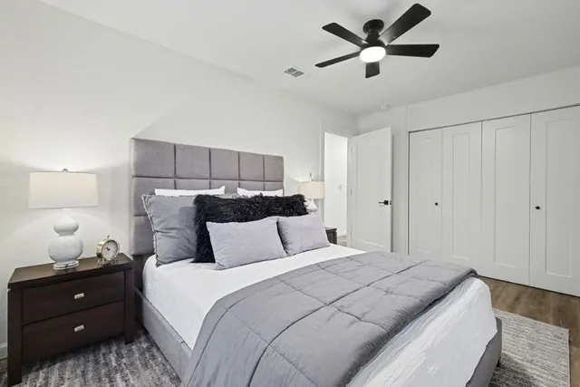 a bedroom with a bed and window