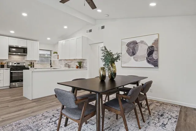a dining room with furniture and window