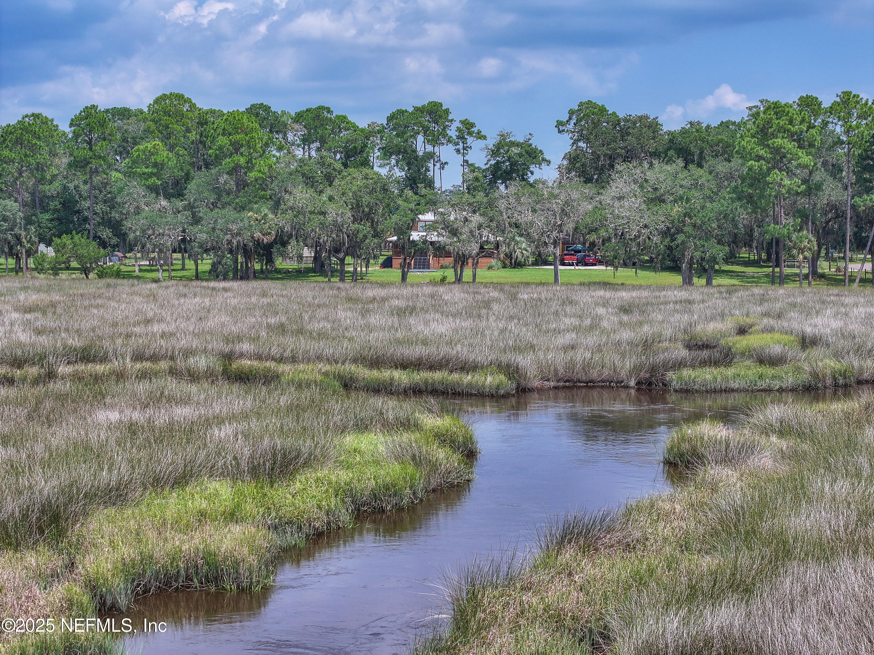 85013 Avant Road Yulee, FL 32097 - Photo 13 of 21 a view of a lake with houses in the background
