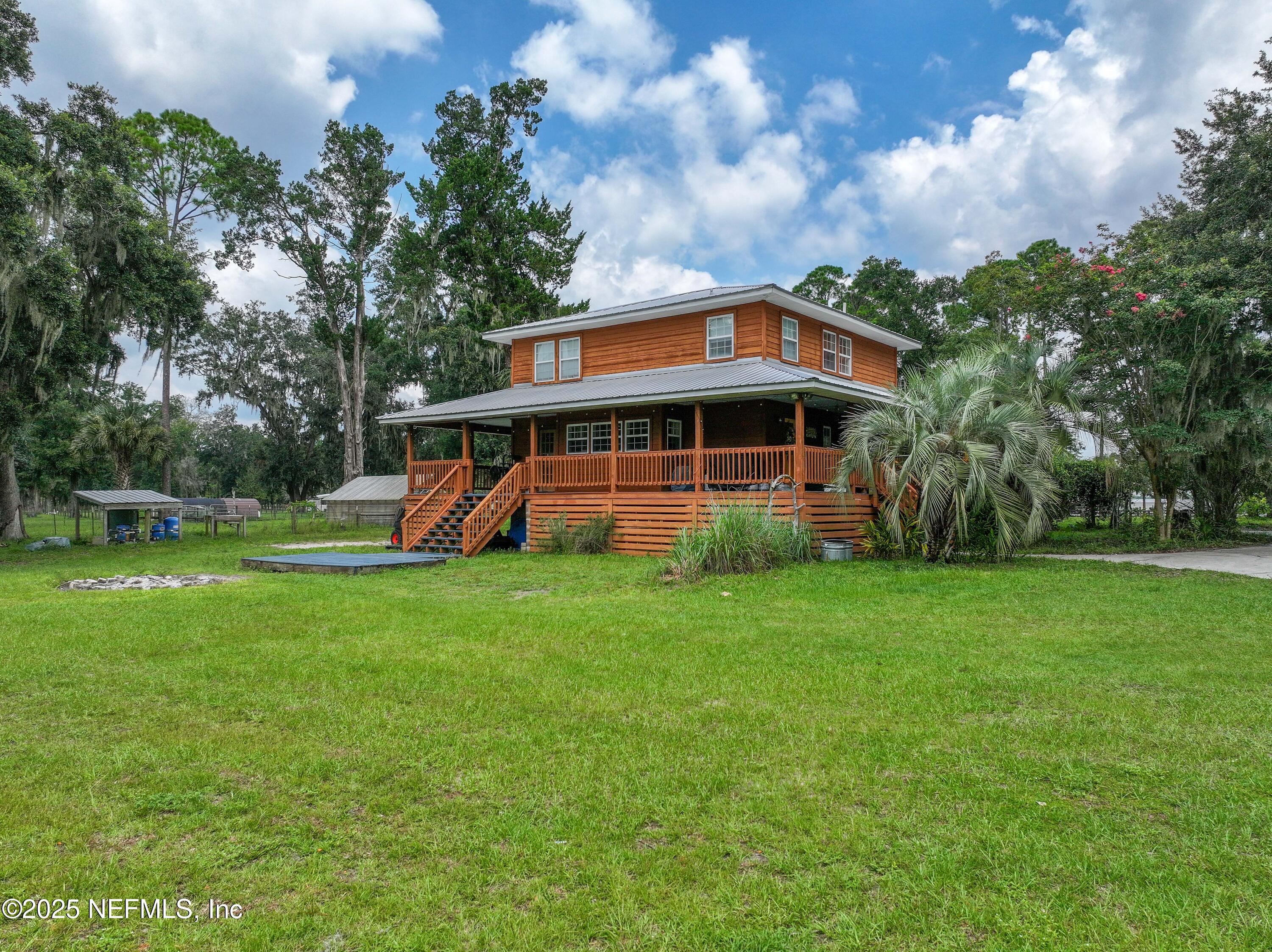 85013 Avant Road Yulee, FL 32097 - Photo 5 of 21 a front view of a house with garden