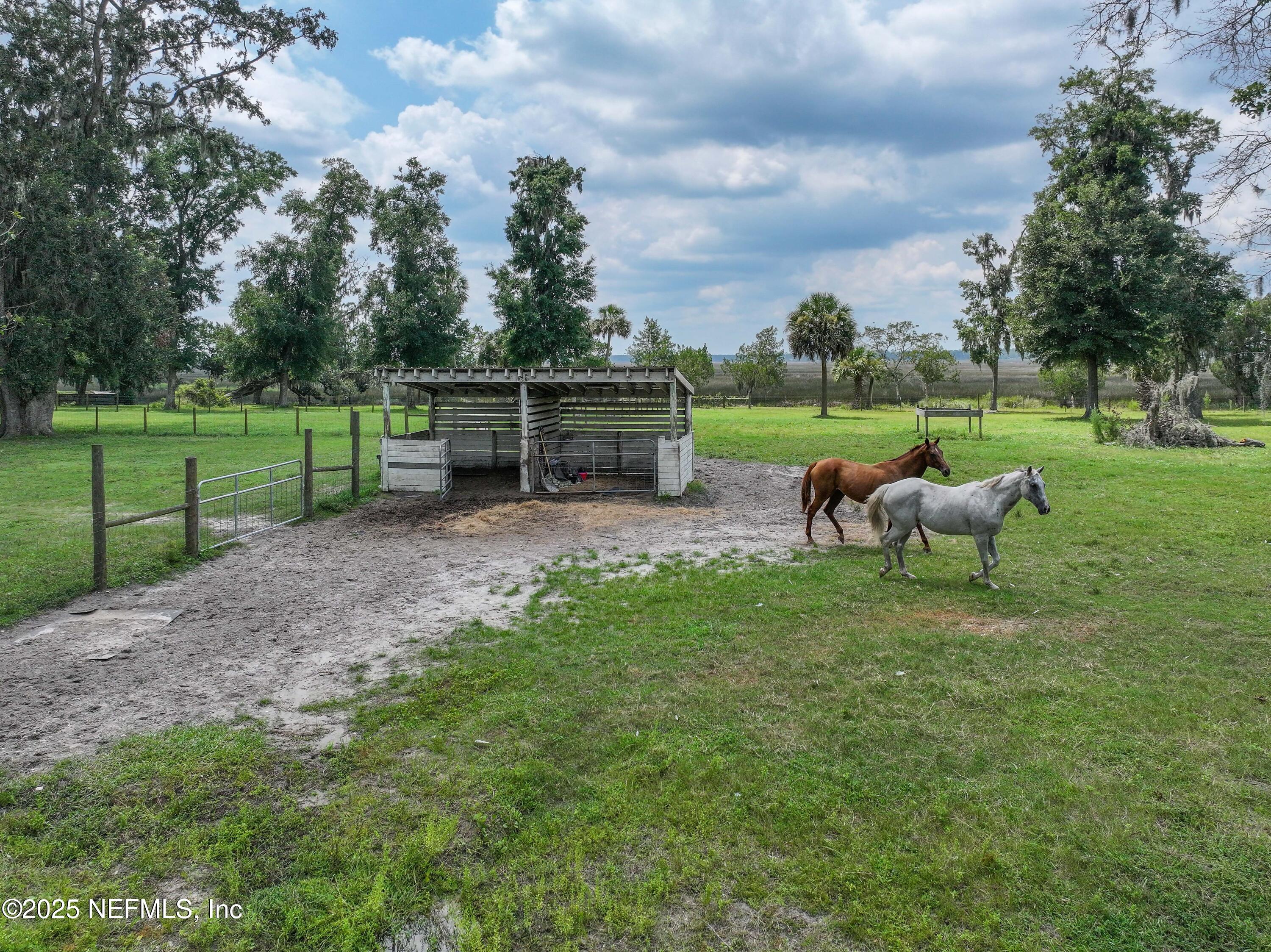85013 Avant Road Yulee, FL 32097 - Photo 8 of 21 a view of a golf course with a garden