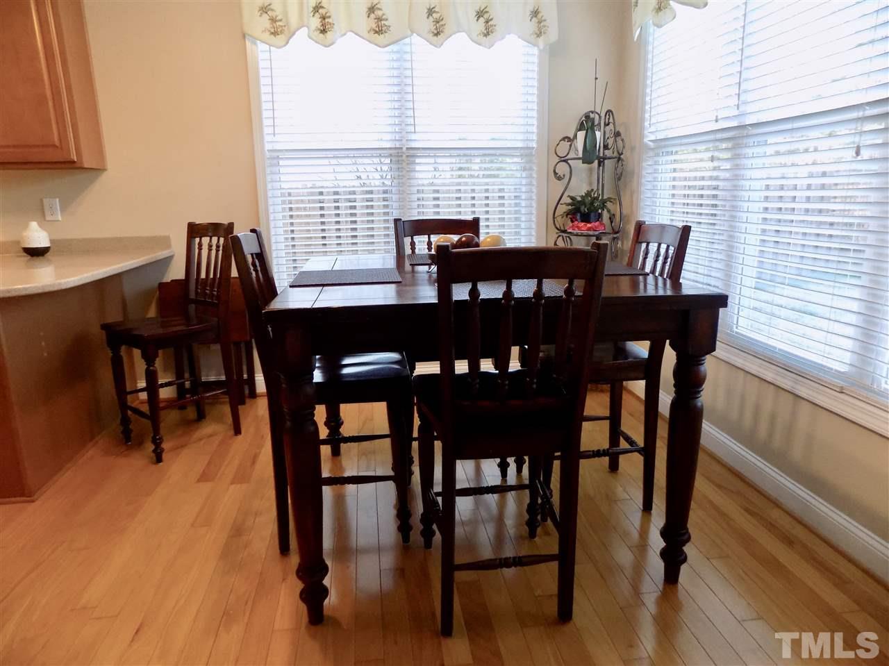 3914 Magnolia Pond Road Raleigh, NC 27610 - Photo 6 of 15 a view of a dining room with furniture and window