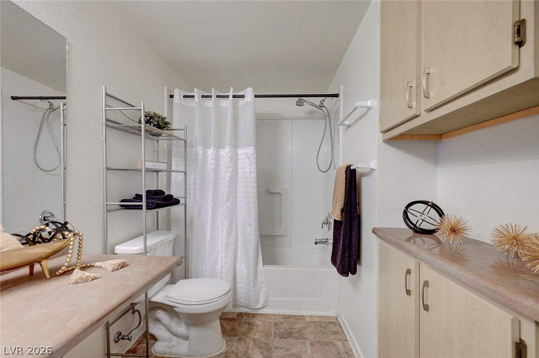 555 East Silverado Ranch Boulevard, Unit 2124 Las Vegas, NV 89183 - Photo 31 of 47 A clean, functional bathroom boasts a combination tub and shower alongside ample vanity space.