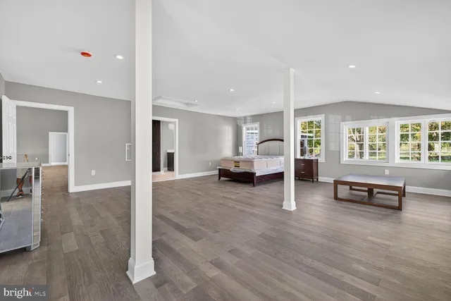 a view of a livingroom with furniture and windows