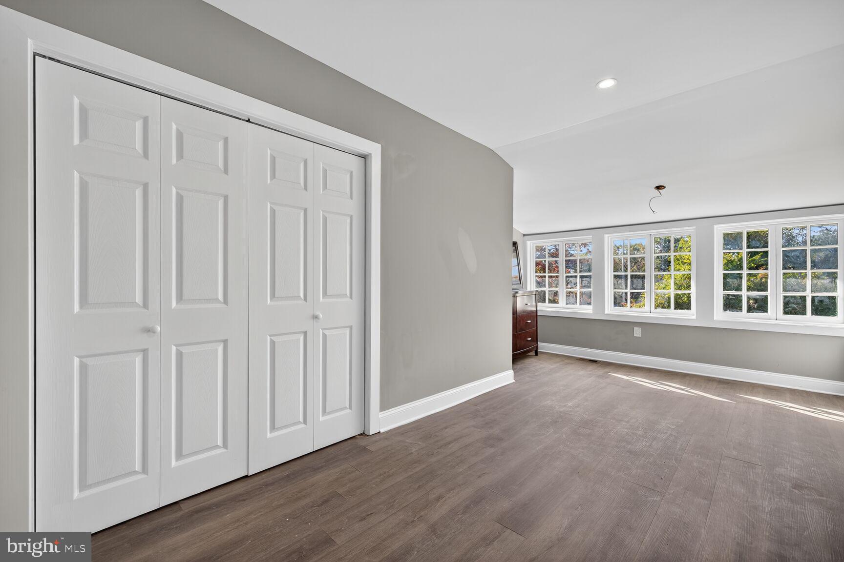 401 Linden Avenue Frederick, MD 21703 - Photo 17 of 29 an empty room with wooden floor and windows