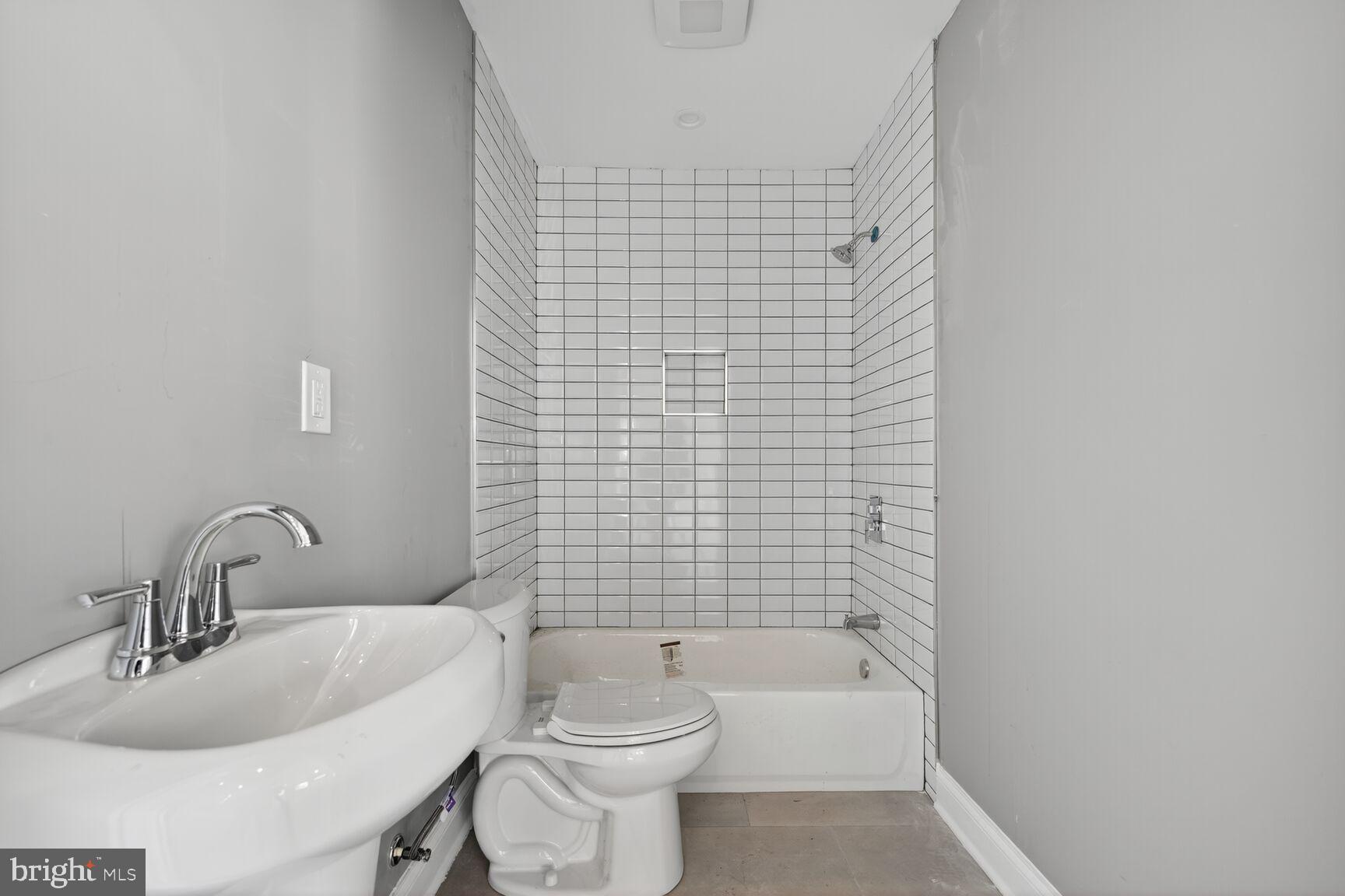 401 Linden Avenue Frederick, MD 21703 - Photo 23 of 29 a bathroom with a sink a toilet and shower