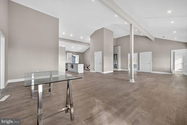 a view of a hallway with seating space