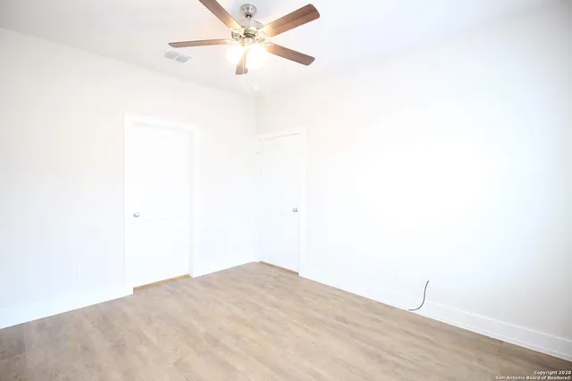 a utility room with cabinets washer and dryer