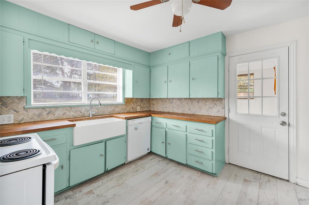 531 Coe Road Denison, TX 75021 - Photo 14 of 22 a kitchen with sink and window