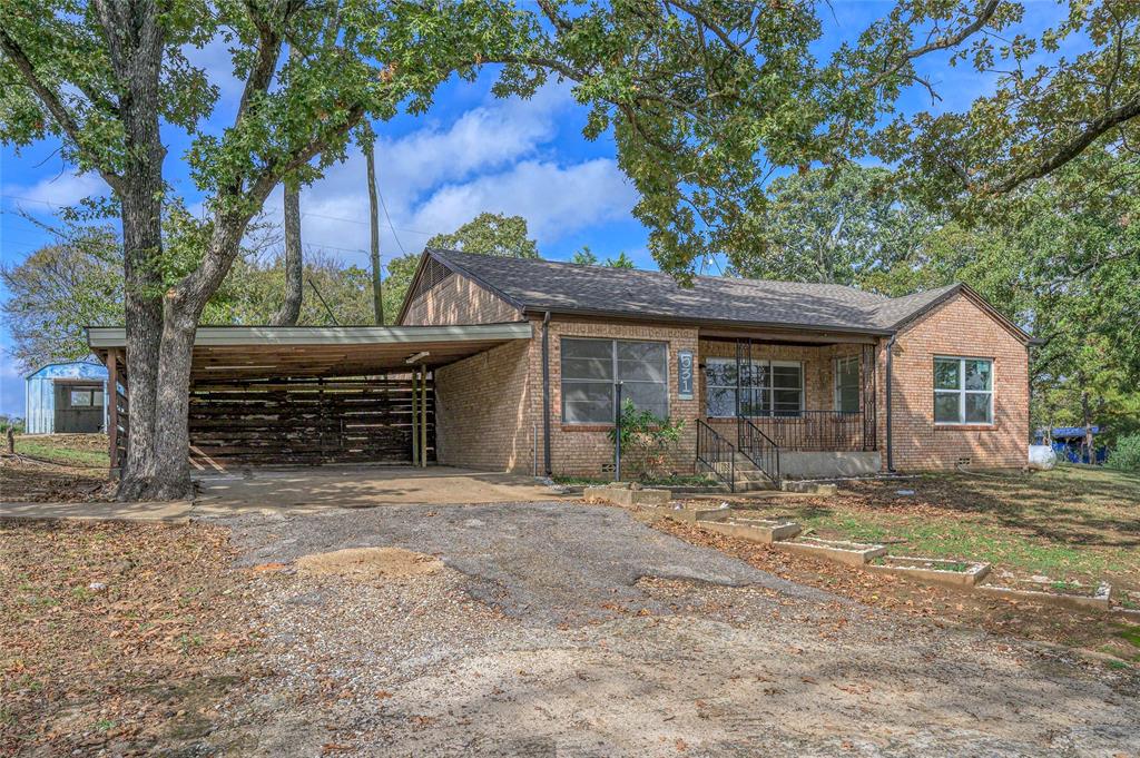 531 Coe Road Denison, TX 75021 - Photo 2 of 22 a front view of a house with a yard