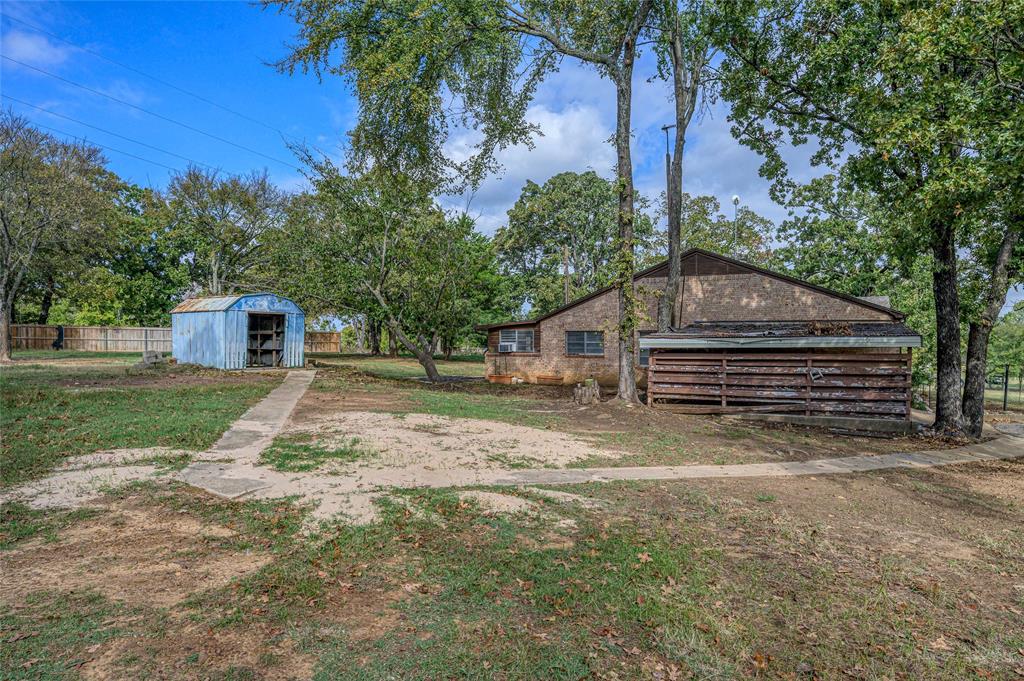 531 Coe Road Denison, TX 75021 - Photo 22 of 22 a house view with a backyard space