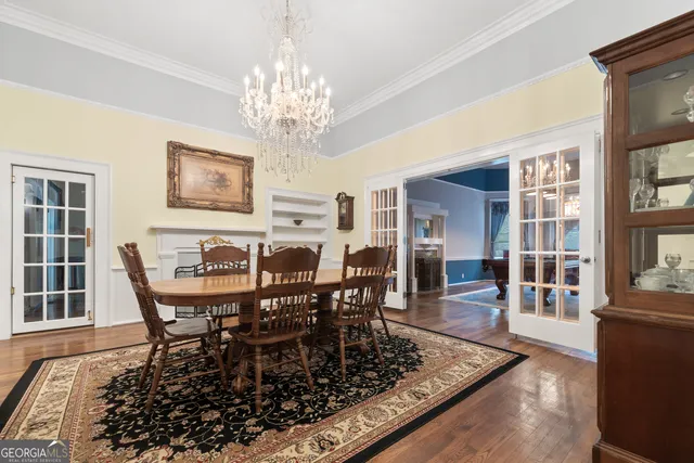 a spacious bedroom with a bed and a chandelier