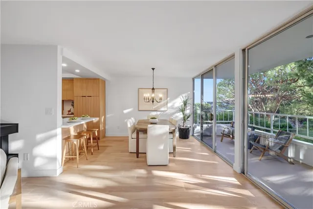 a kitchen with a sink and wooden floor