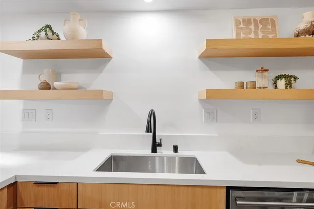 a kitchen with a large window and a counter space