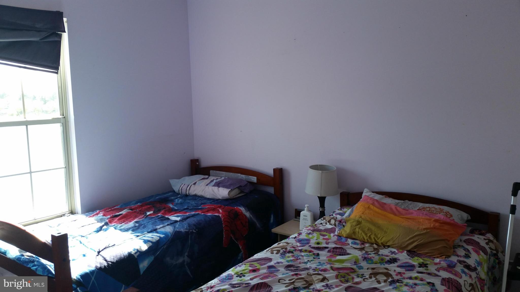 44072 Florence Terrace Ashburn, VA 20147 - Photo 14 of 14 a bedroom with a bed and a window