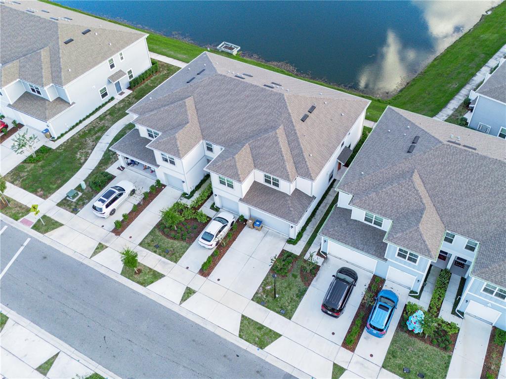 4580 Sparkling Shell Avenue Kissimmee, FL 34746 - Photo 12 of 42 an aerial view of multiple houses with yard