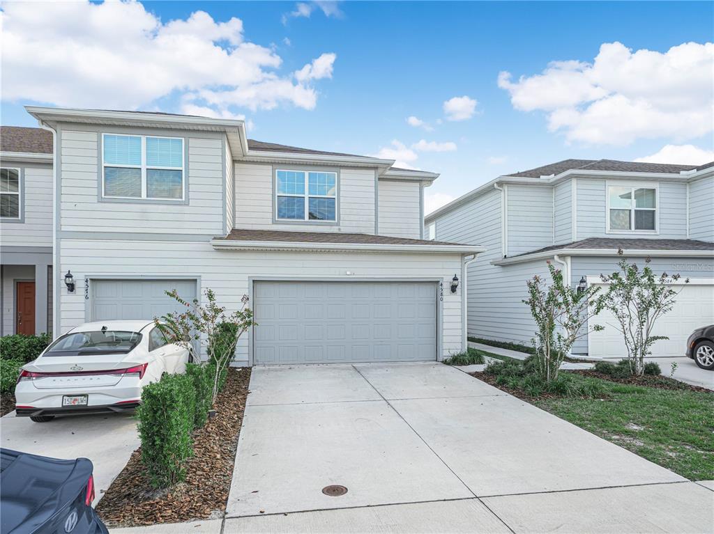 4580 Sparkling Shell Avenue Kissimmee, FL 34746 - Photo 13 of 42 a front view of a house with garden
