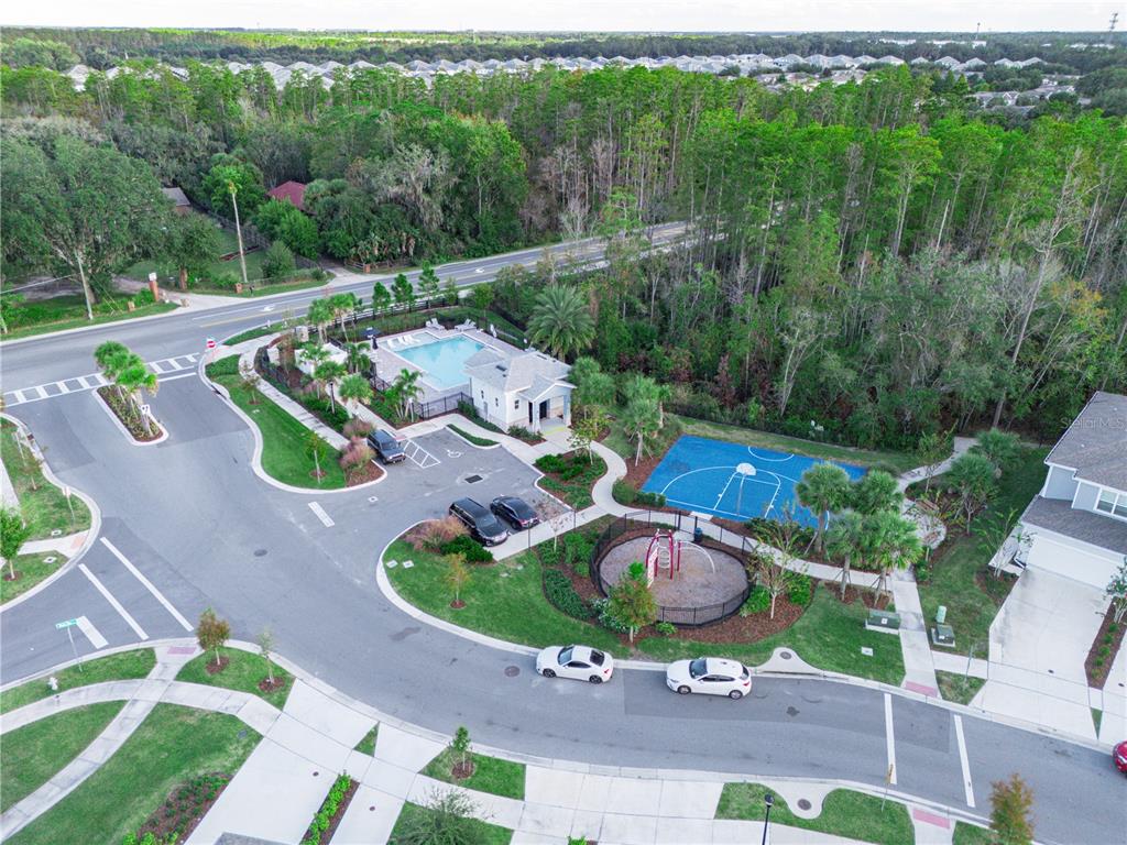 4580 Sparkling Shell Avenue Kissimmee, FL 34746 - Photo 2 of 42 an aerial view of a house with garden space and street view