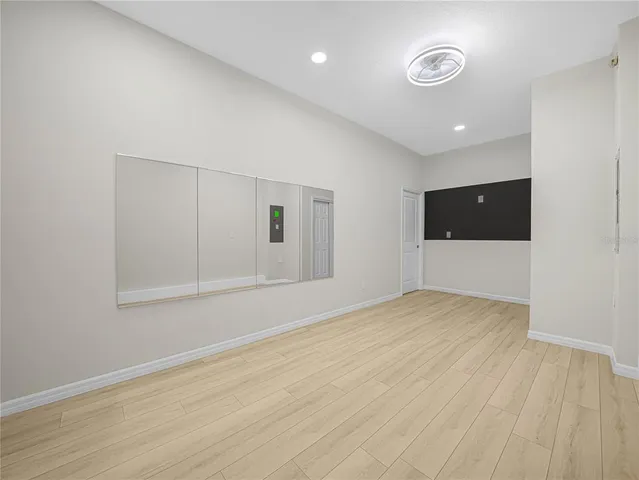 a bathroom with double sink and a mirror