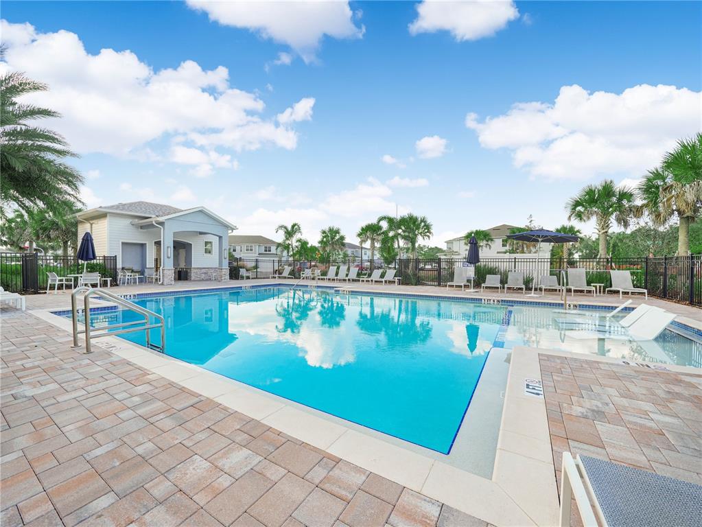 4580 Sparkling Shell Avenue Kissimmee, FL 34746 - Photo 3 of 42 a view of a swimming pool with a lounge chair