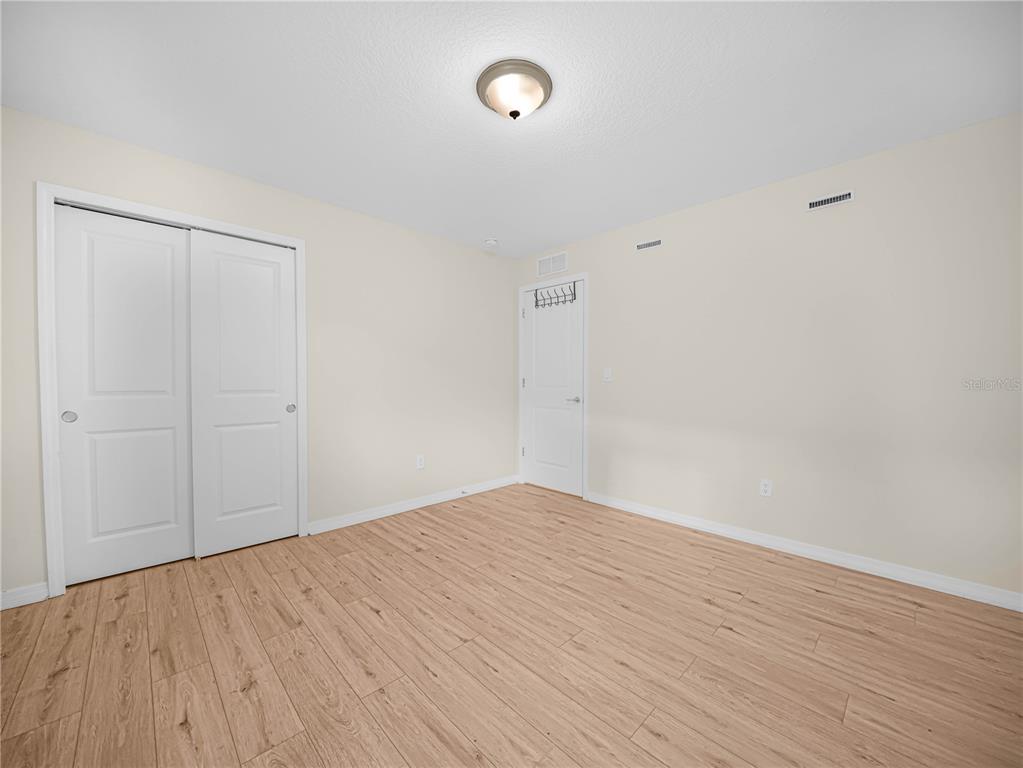 4580 Sparkling Shell Avenue Kissimmee, FL 34746 - Photo 39 of 42 a view of empty room with wooden floor