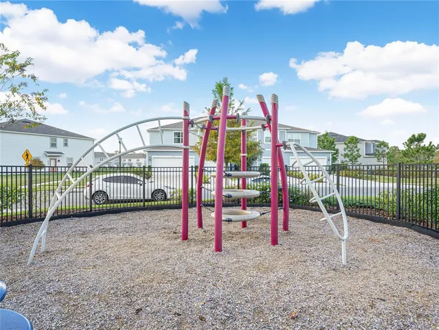 a view of a park with swings and slides