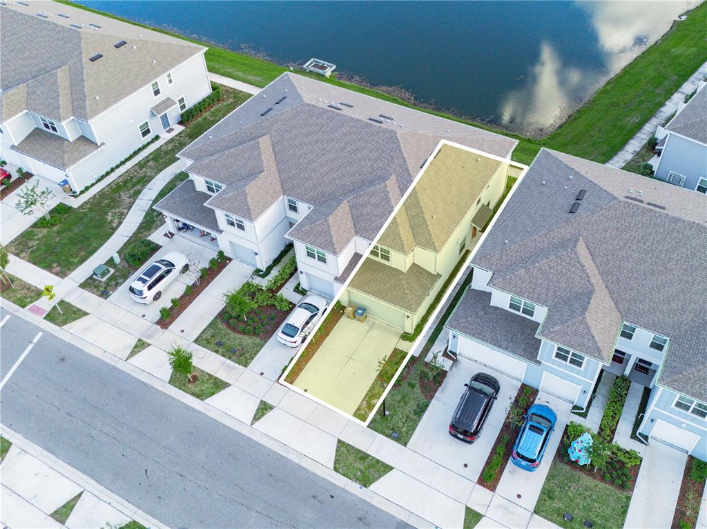 4580 Sparkling Shell Avenue Kissimmee, FL 34746 - Photo 7 of 42 an aerial view of residential house with outdoor space and parking