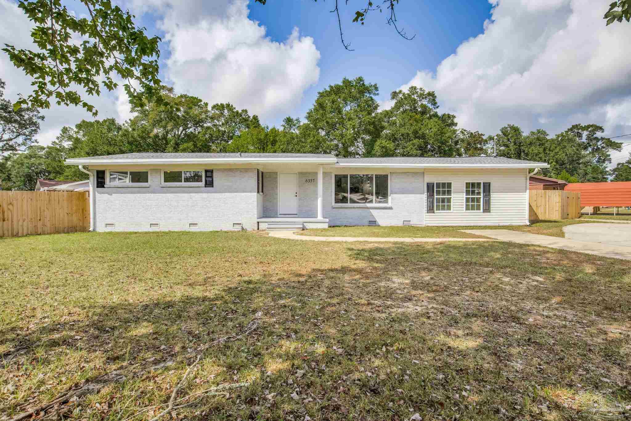 6357 Shady Lane Milton, FL 32570 - Photo 1 of 57 a house view with a garden space