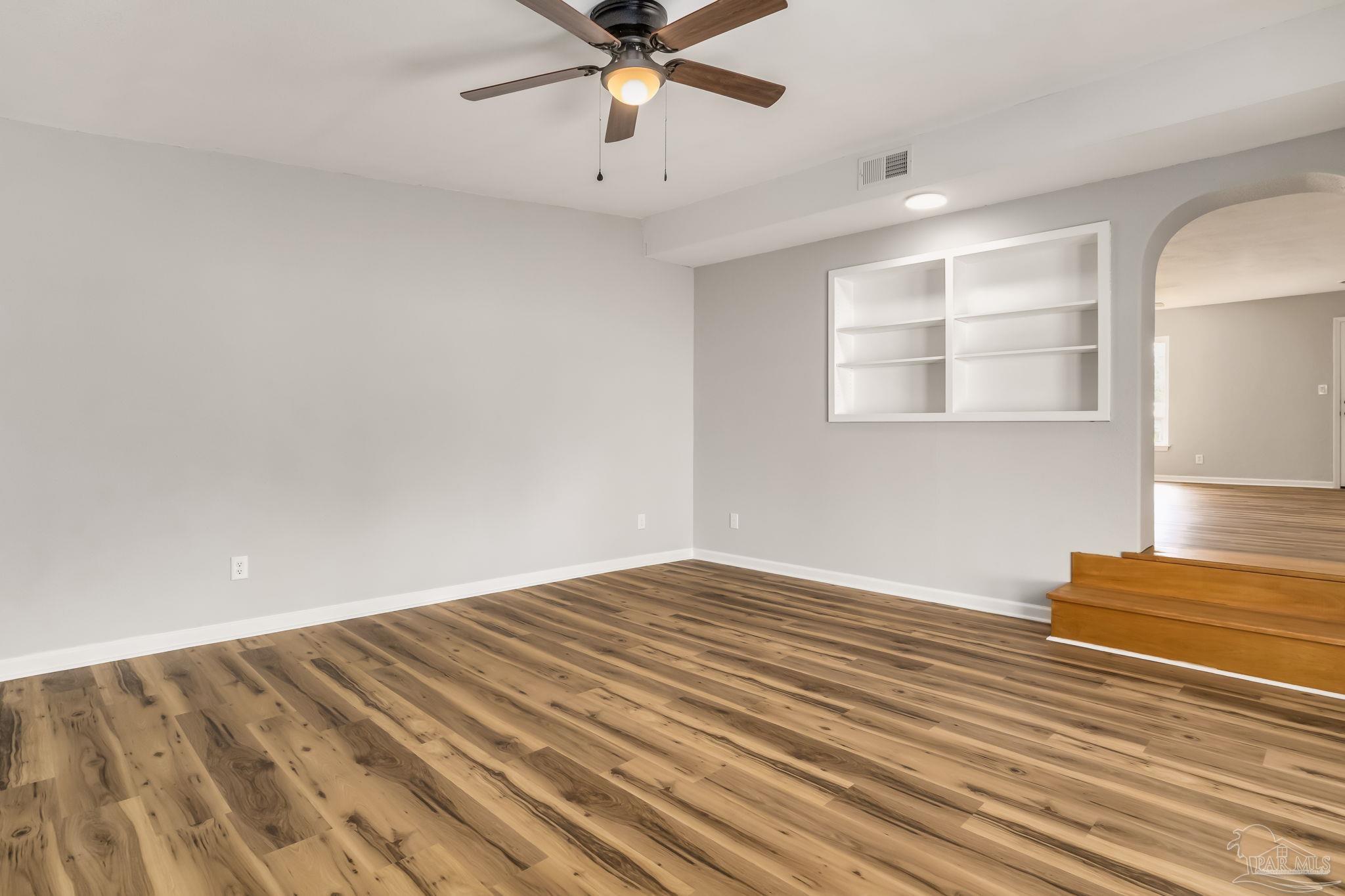 6357 Shady Lane Milton, FL 32570 - Photo 15 of 57 wooden floor in an empty room