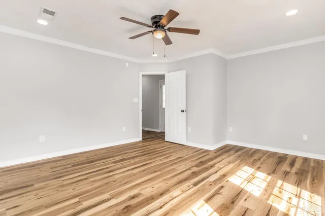 a view of a room with a ceiling fan