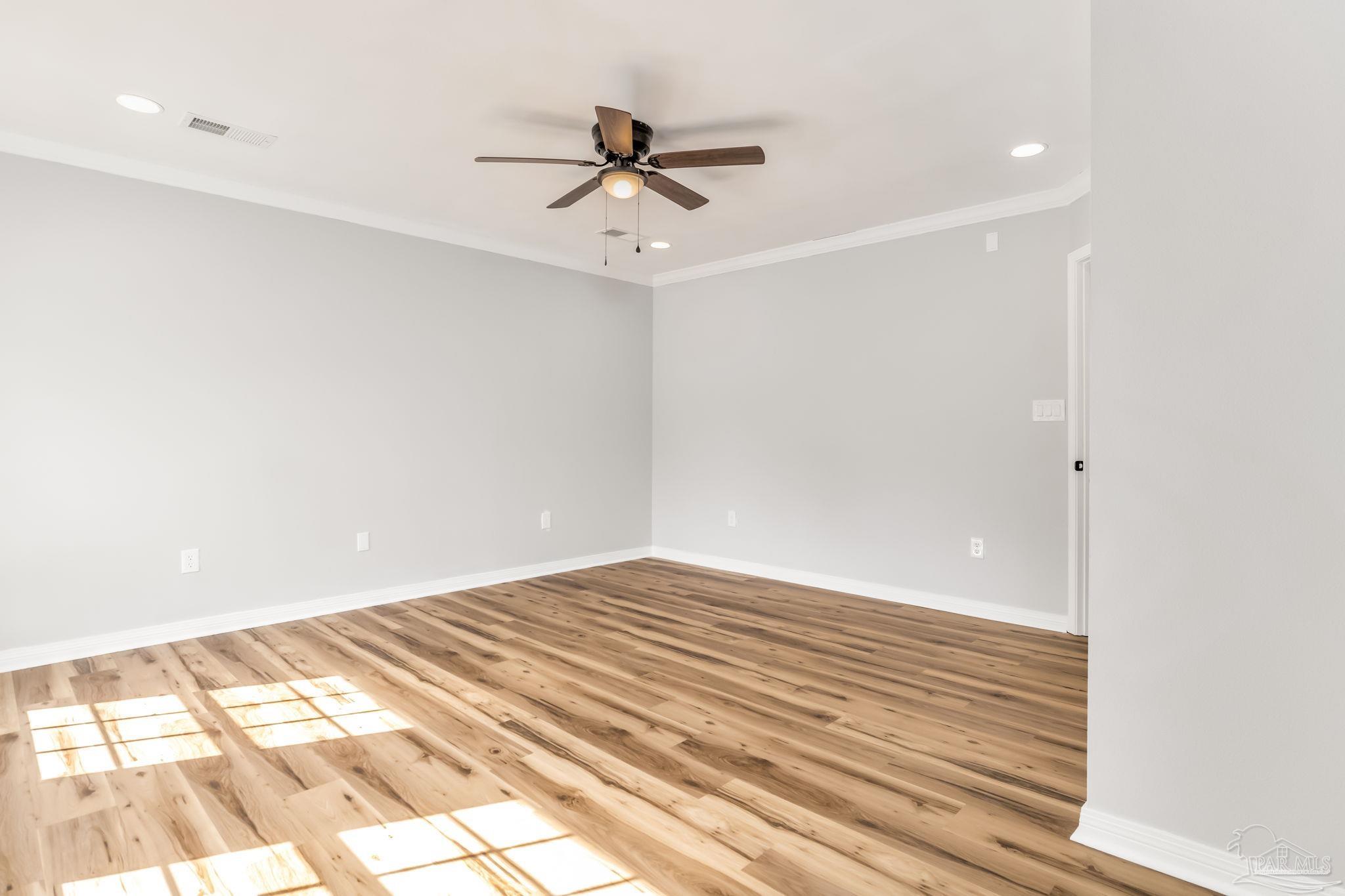 6357 Shady Lane Milton, FL 32570 - Photo 21 of 57 a view of a room with a ceiling fan
